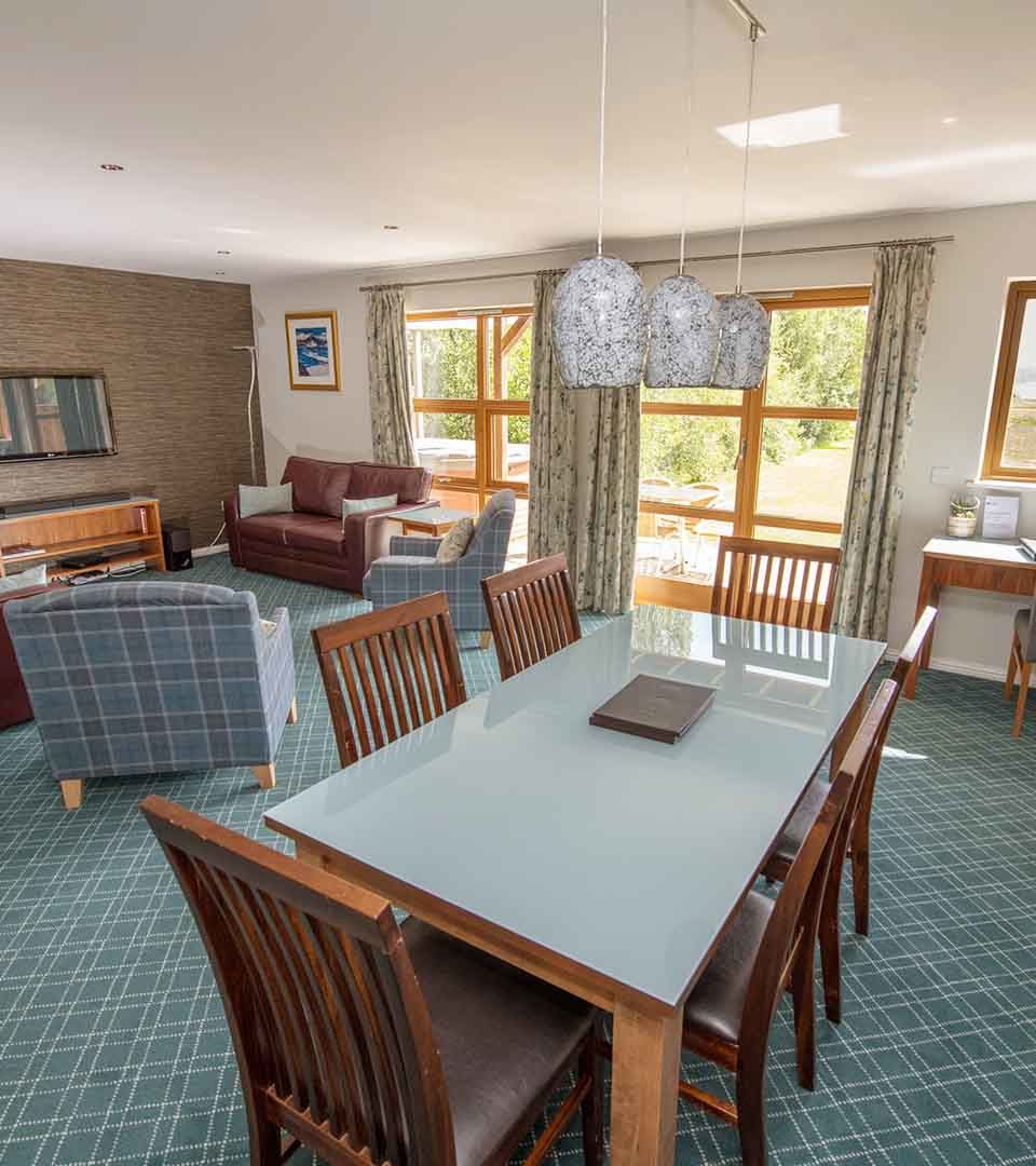 An open plan living dining room in a Diamond Lodge at Loch Lomond Waterfront