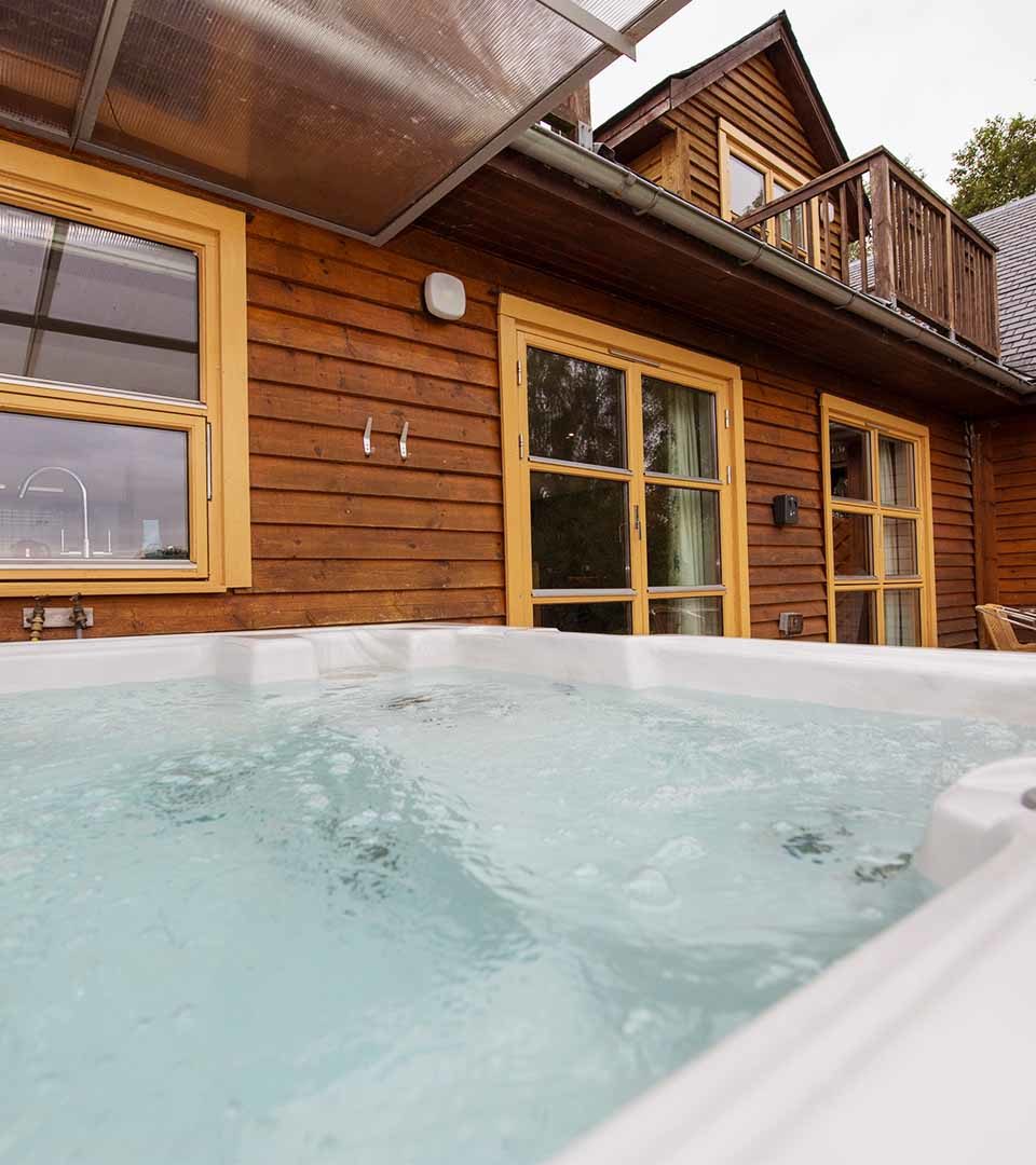 A hot tub outside a Diamond Lodge at Loch Lomond Waterfront