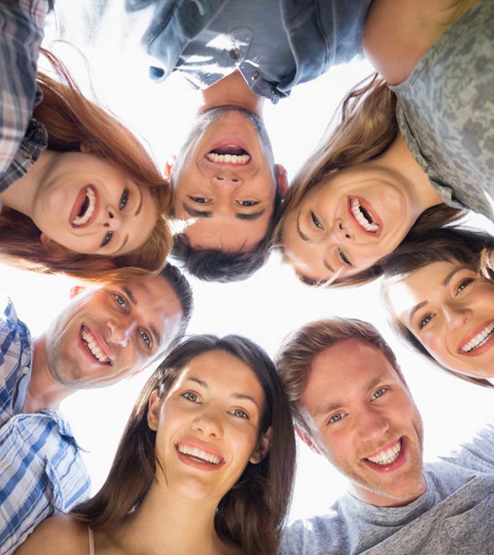 Group of friend in a circle laughing