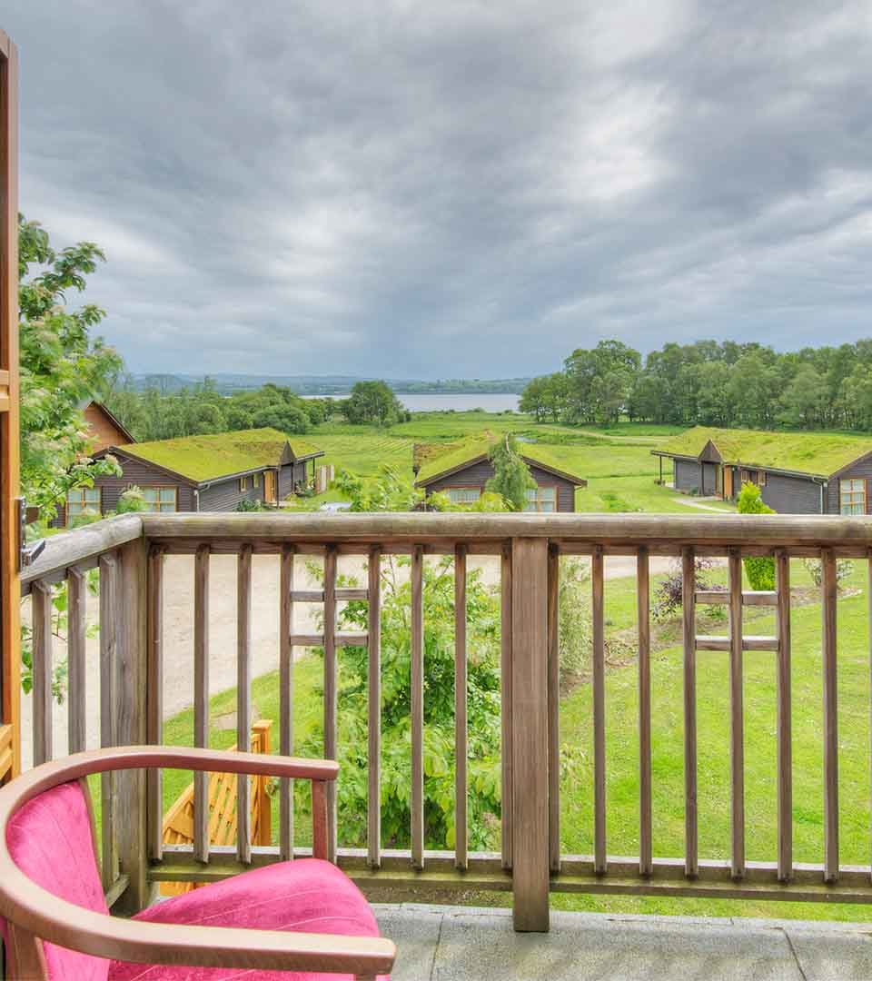 A balcony with a view of Loch Lomond at one of the lodges at Loch Lomond Waterfront