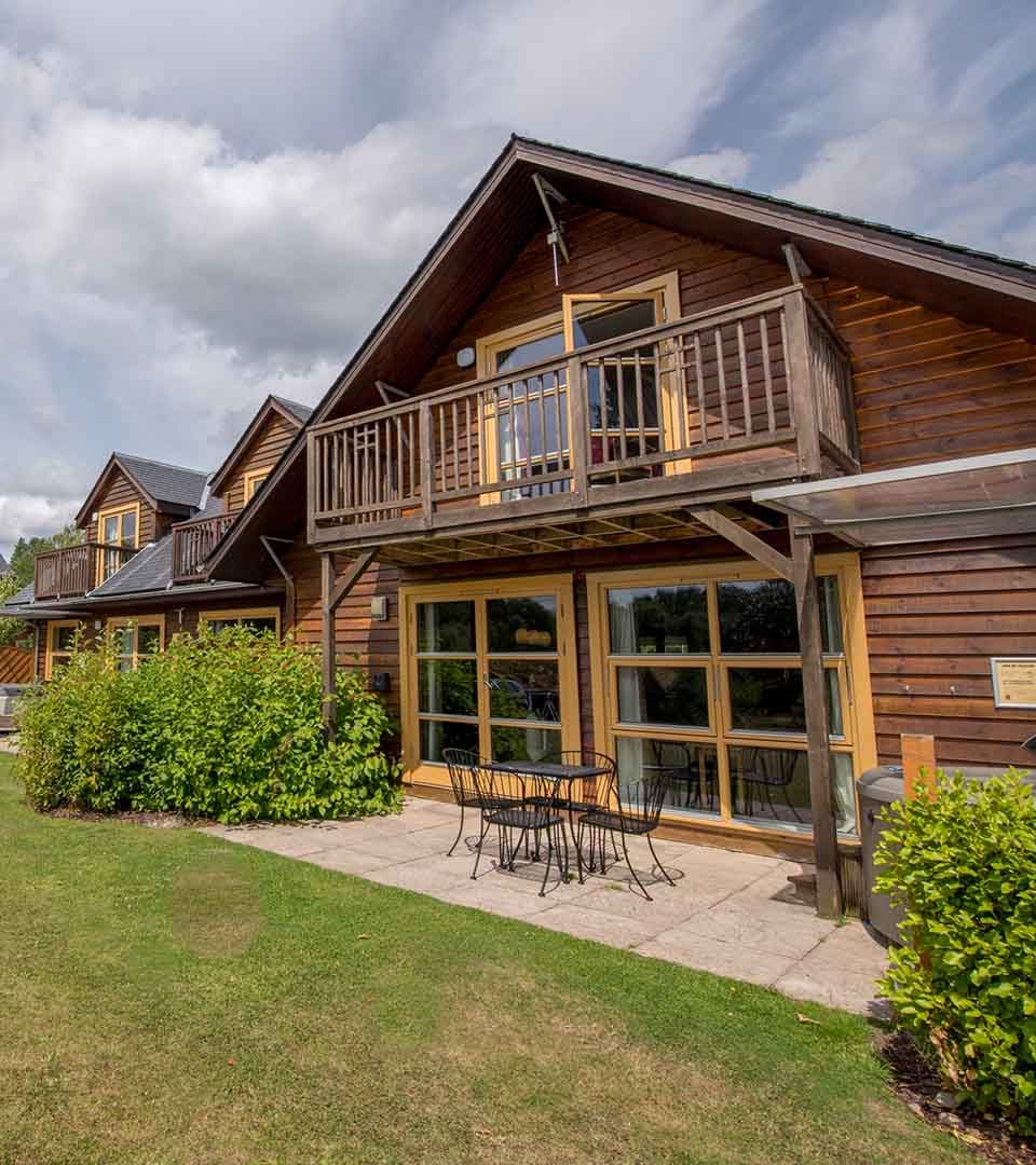 The exterior of a lodge at Loch Lomond Waterfront