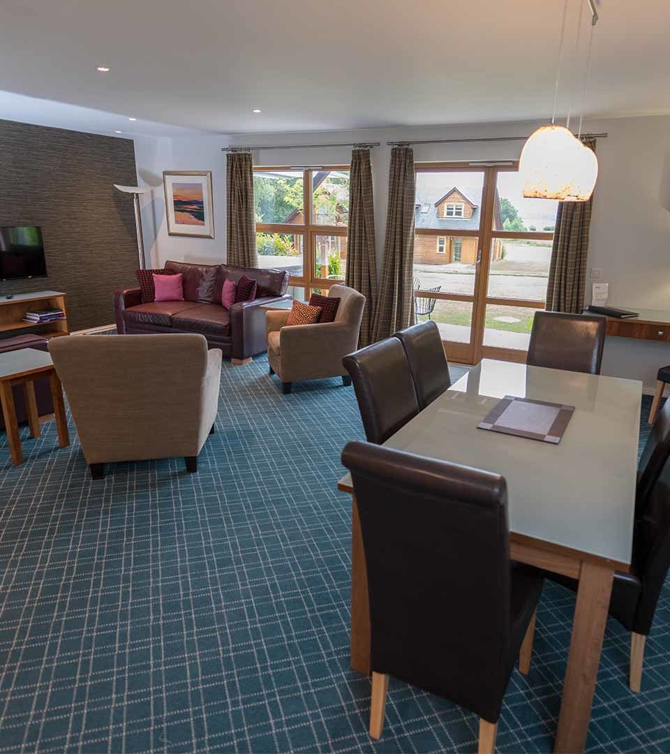 Open plan living area in a lodge at Loch Lomond Waterfront