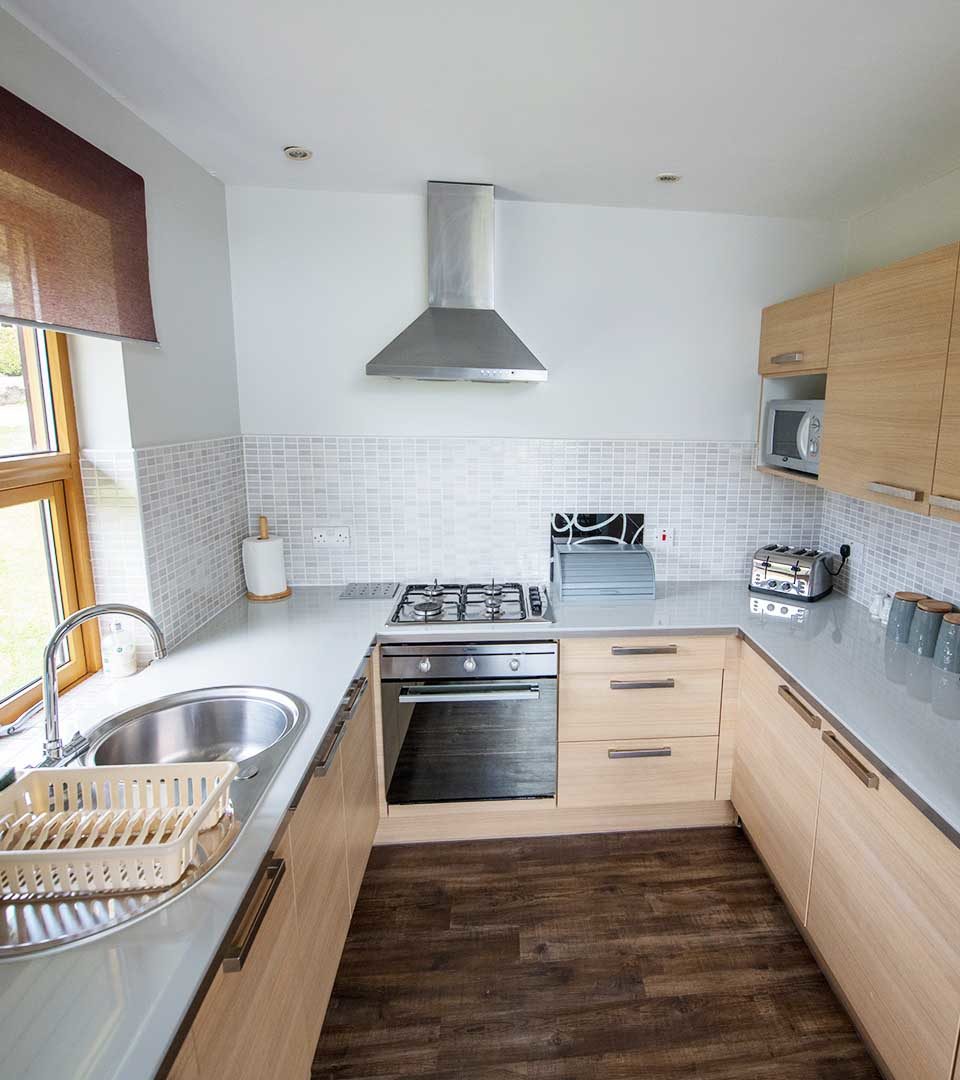 A kitchen in a chalet at Loch Lomond Waterfront