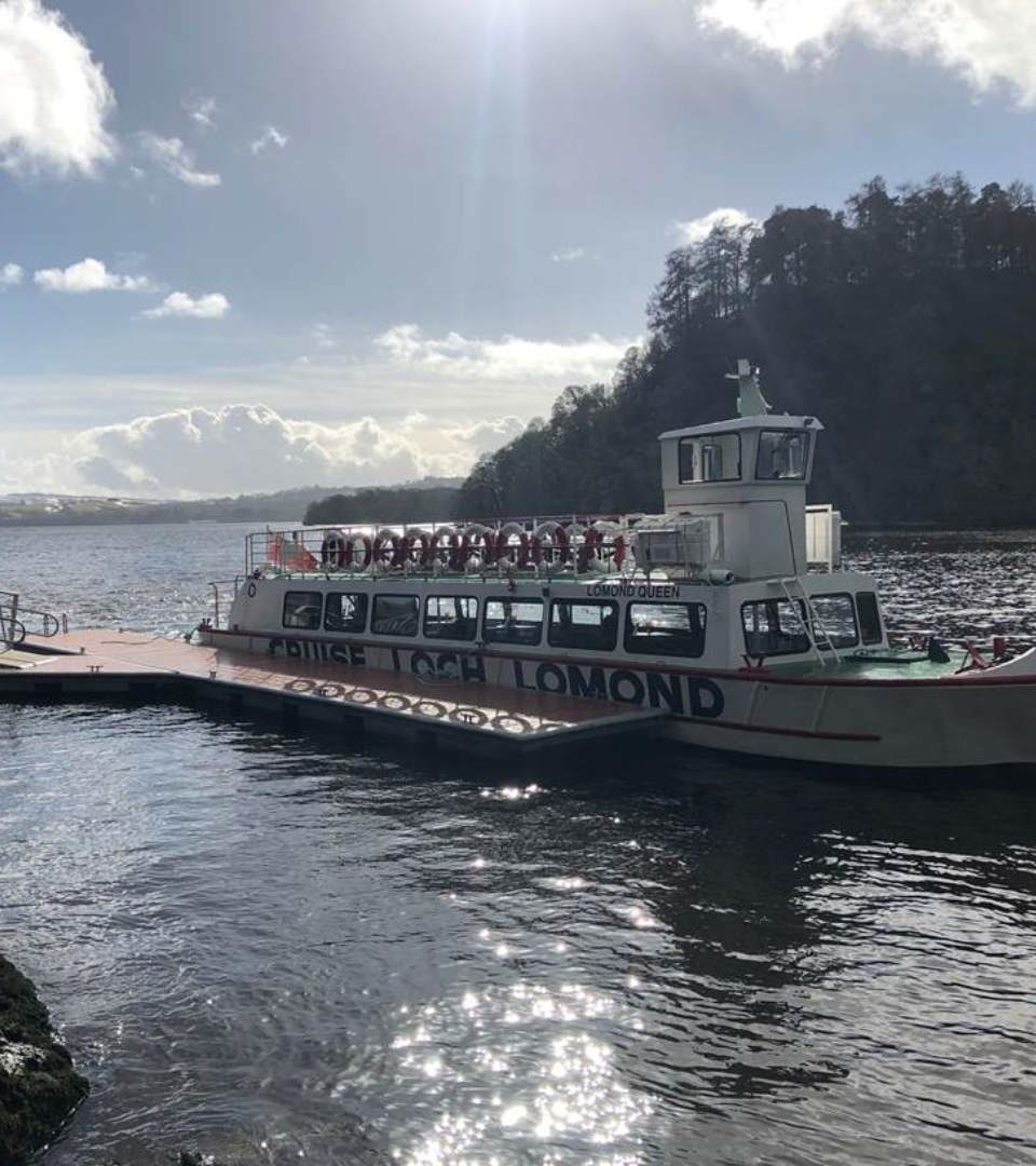 A boat cruising on a Scottish Loch