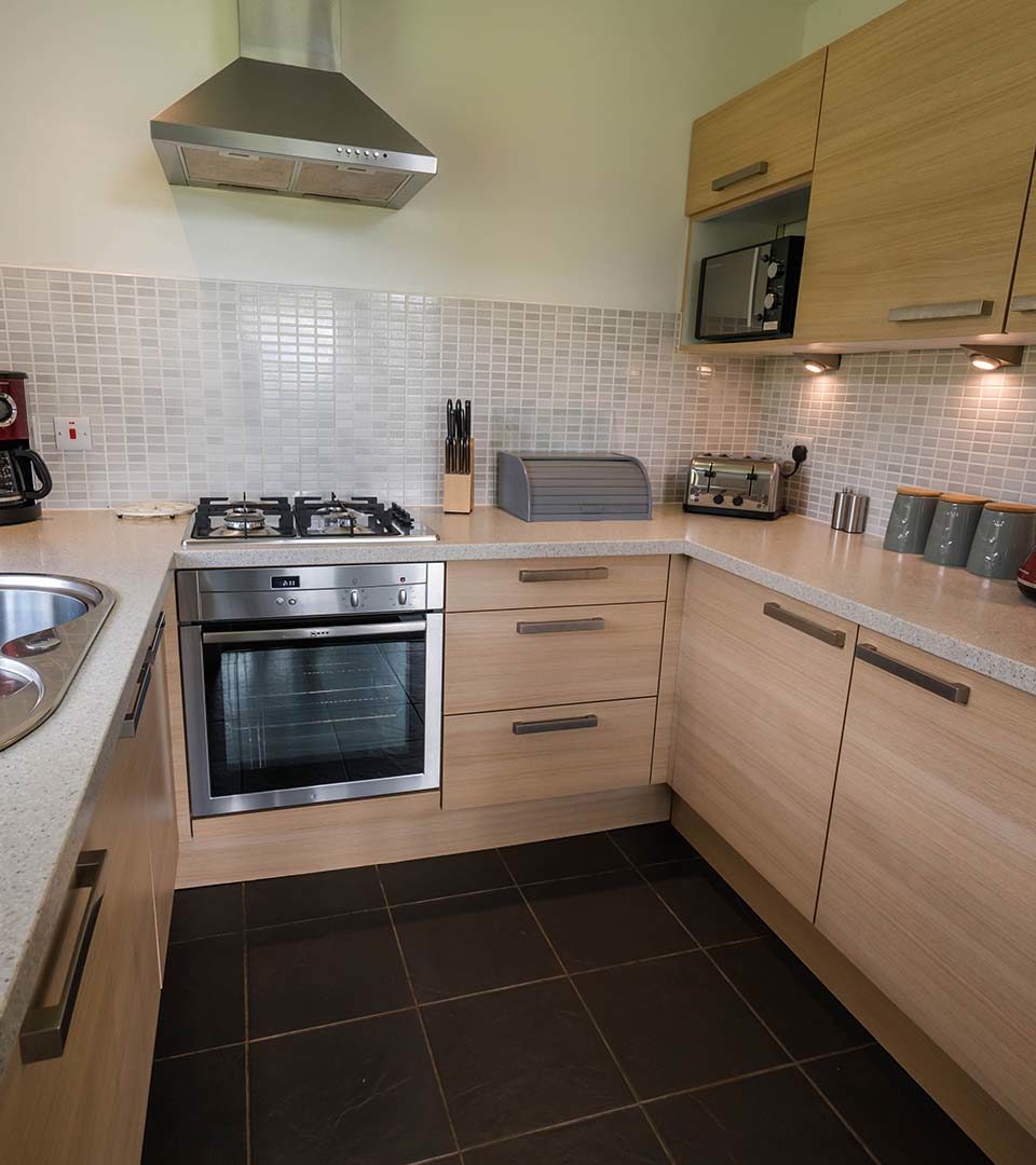 The kitchen the Drummond / Honeymoon Suite chalet at Loch Lomond Waterfront in Balmaha