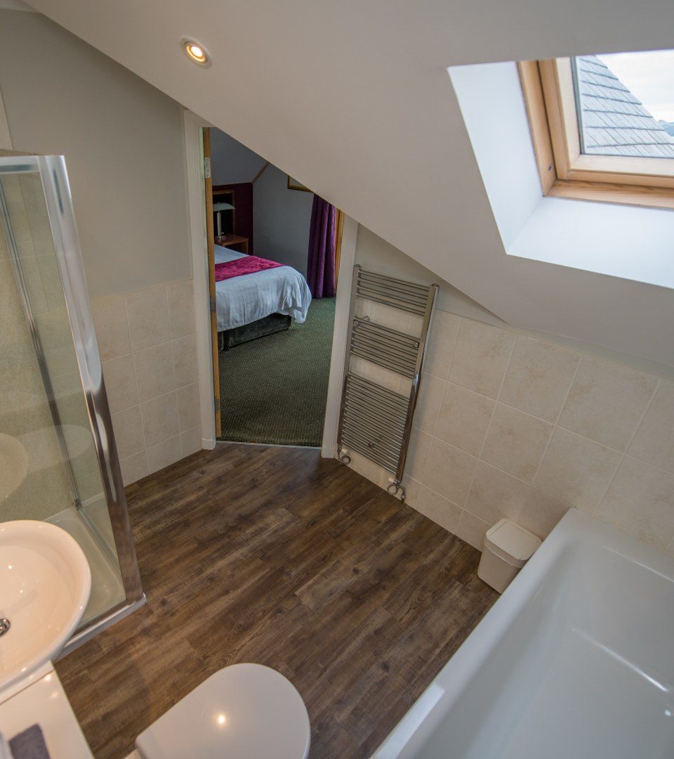 Lodge Bathroom with a view of Loch Lomond through the window