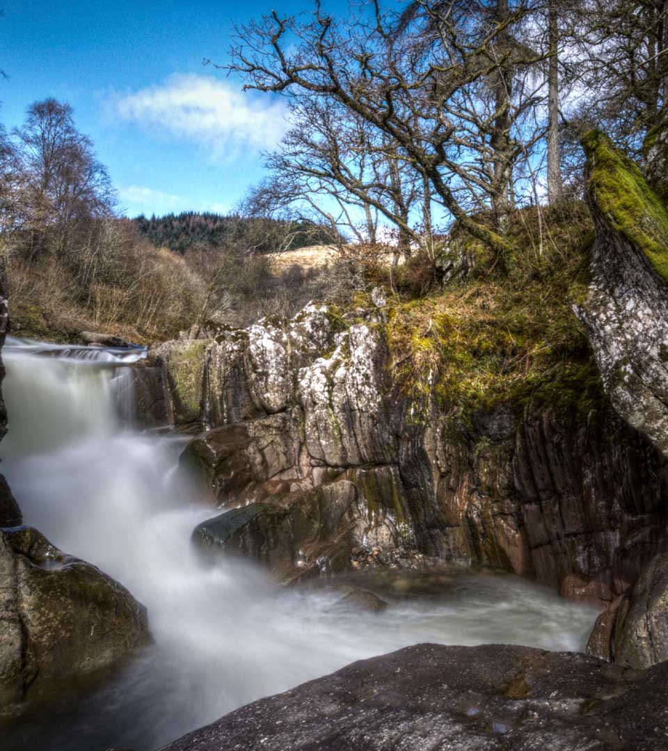 Waterfall at Loch Lomond & the Trossachs National Park in autumn