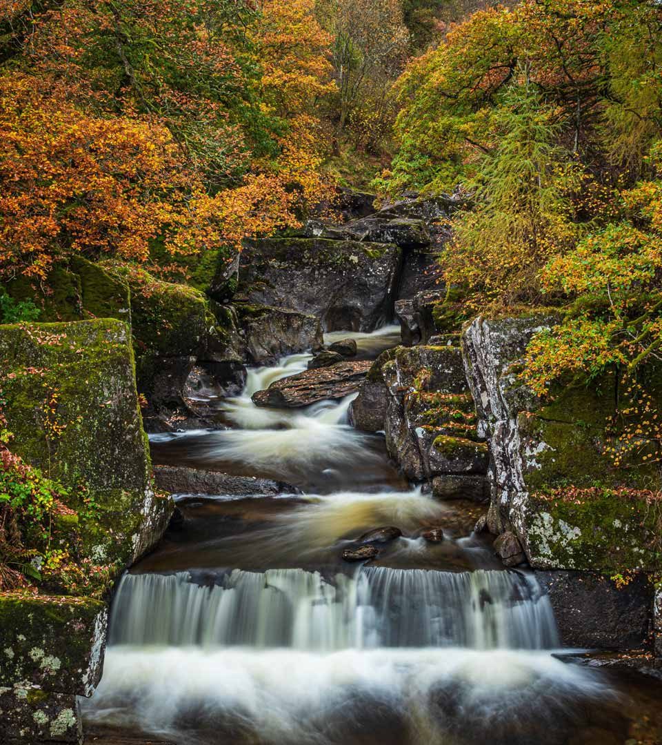 Waterfall at Loch Lomond & the Trossachs National Park in autumn