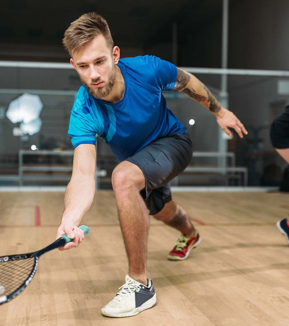 a man playing squash