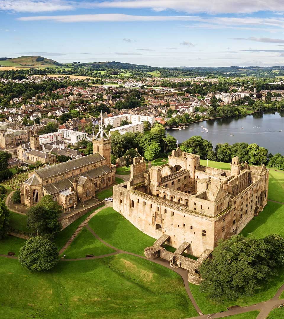 Aerial view of Linlithgow Palace and Loch in Scotland