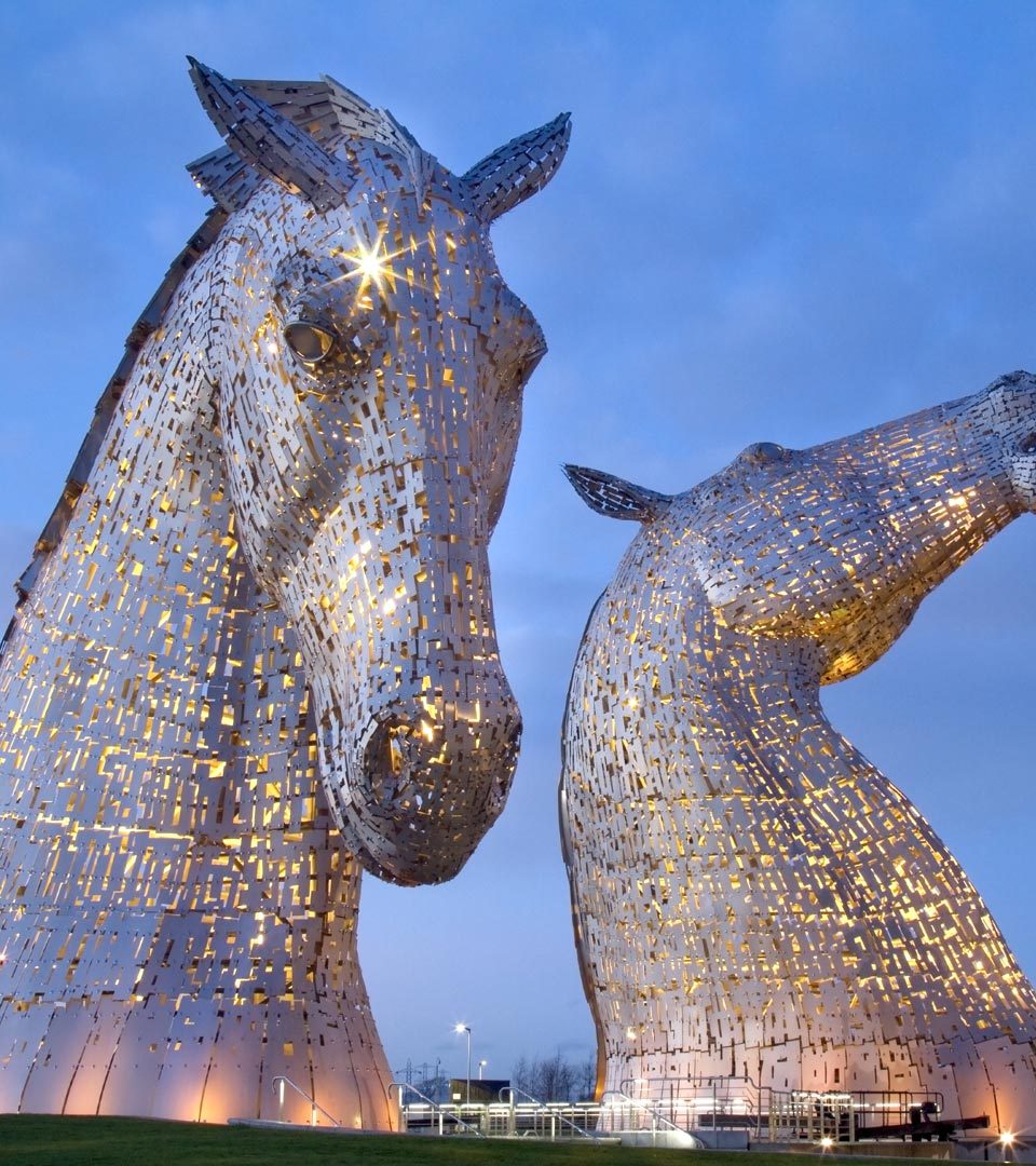 The Kelpies sculptures lit up in the evening