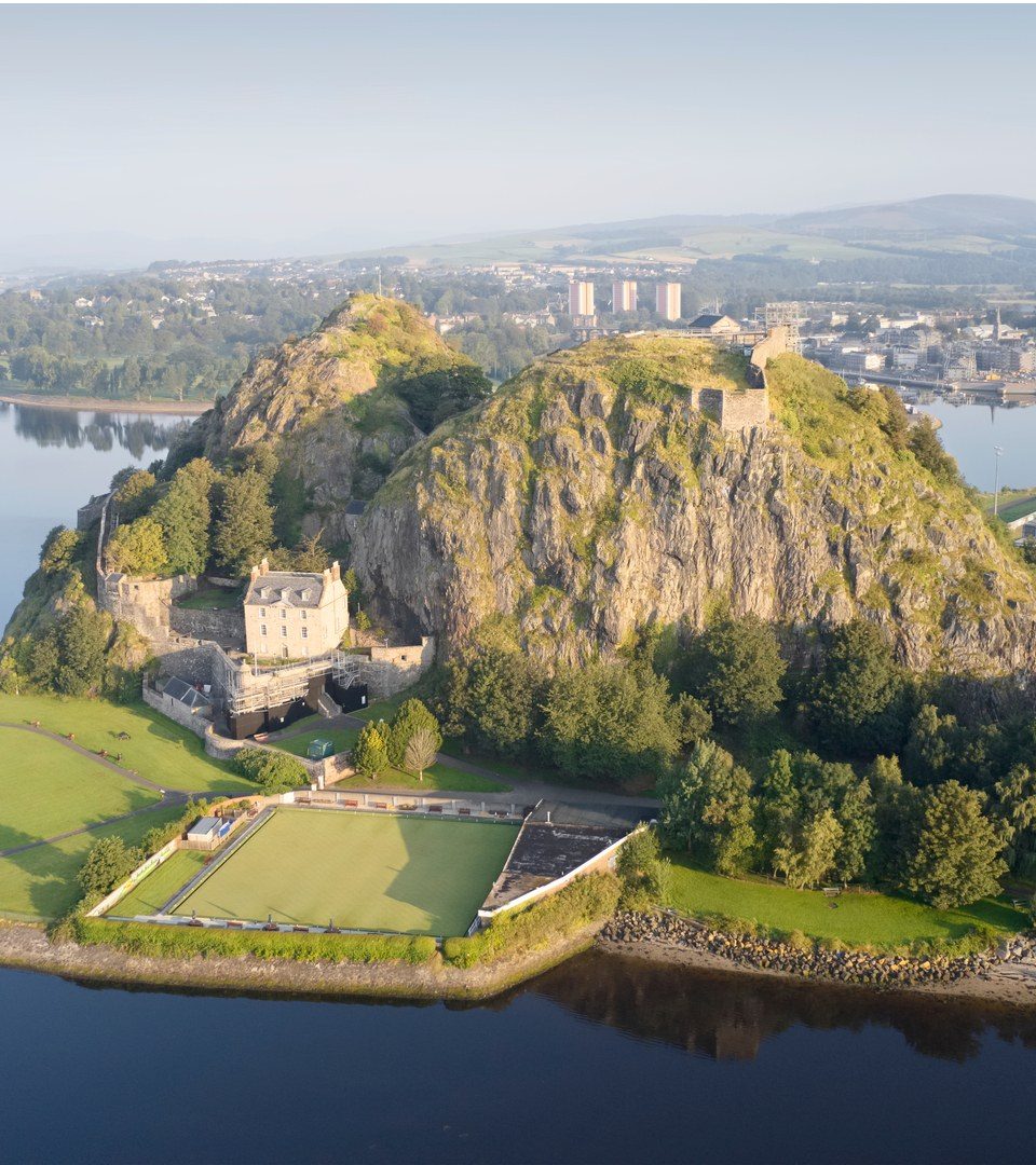 Dumbarton castle building on volcanic rock aerial view from above Scotland UK