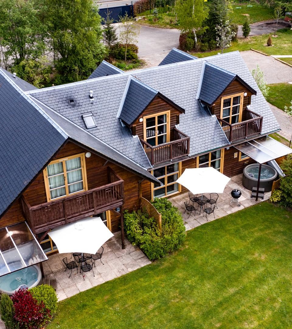 Arial photo of luxury holdiay lodges with their terraces and hot tubs