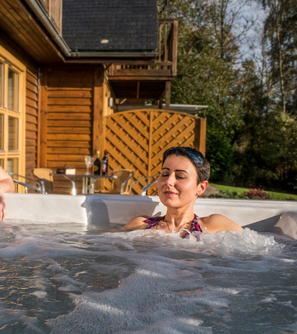 Girl relaxing in the hot tub