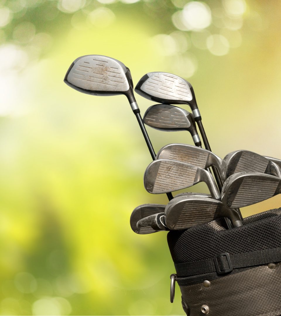 Golf clubs against a green background