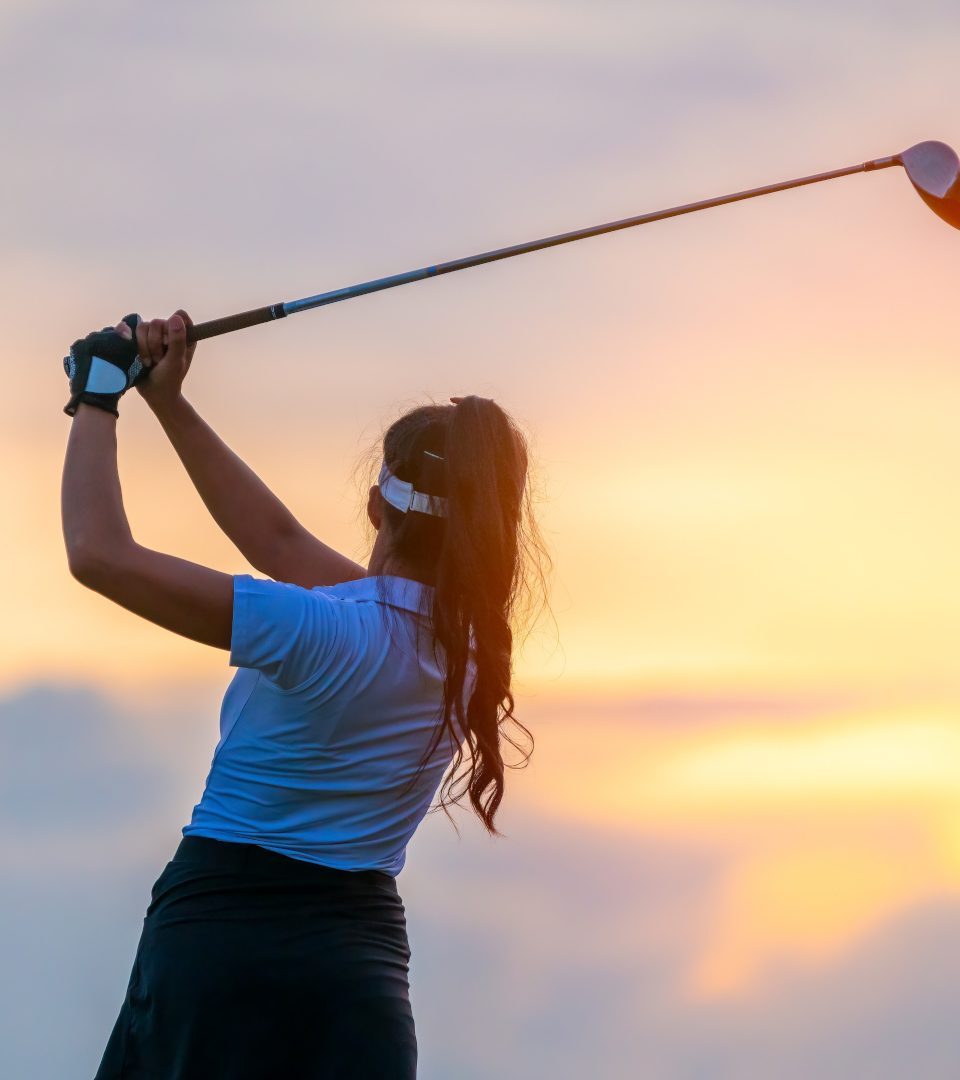 Golfer teeing off