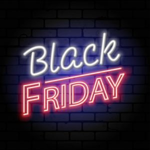 Black Friday banner with words in neon on a black brick background