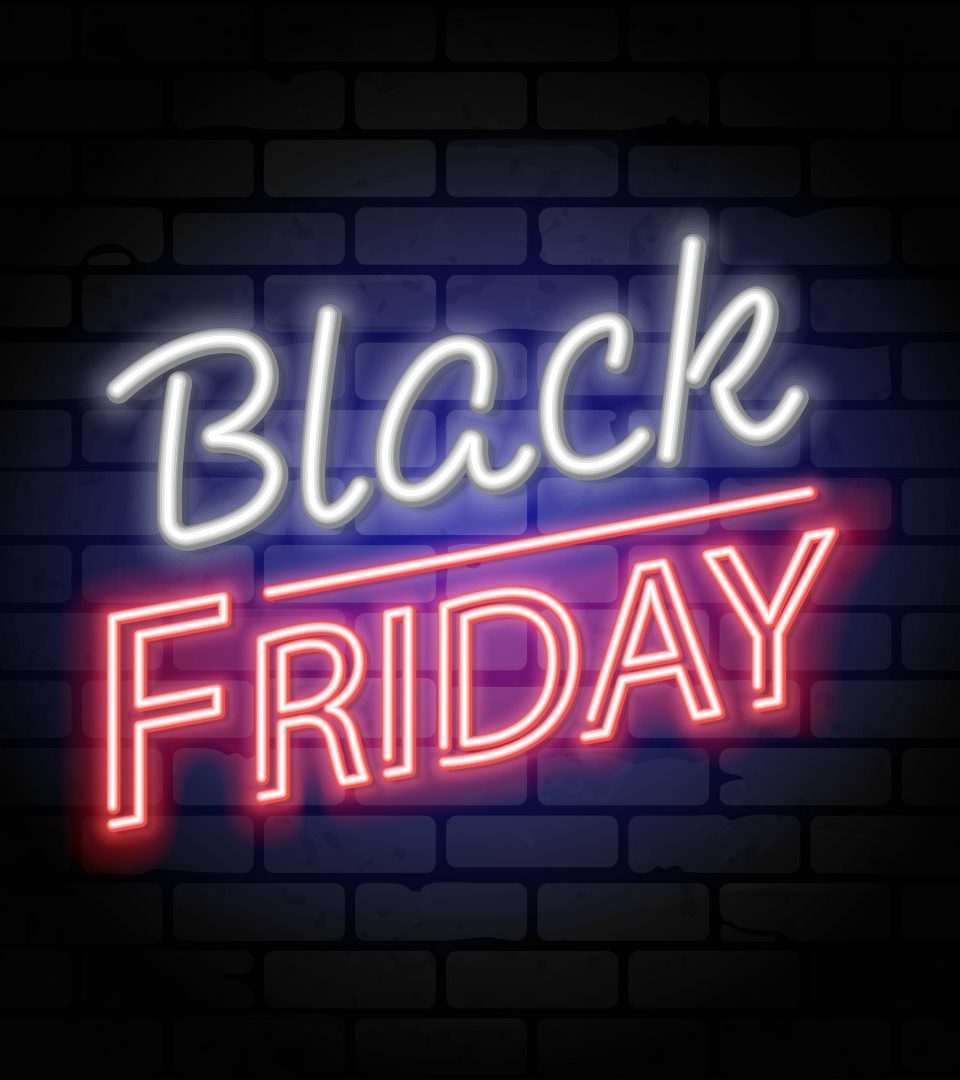 Black Friday banner with words in neon on a black brick background