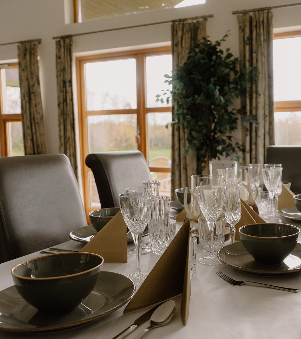 Details of s set dining table in a chalet at Loch Lomond Waterfront luxury lodges in Balmaha