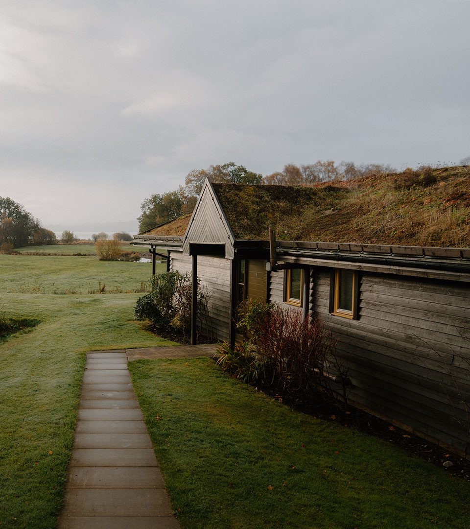 A chalet with a view of Loch Lomond at Loch Lomond Waterfront luxury lodges in Balmaha