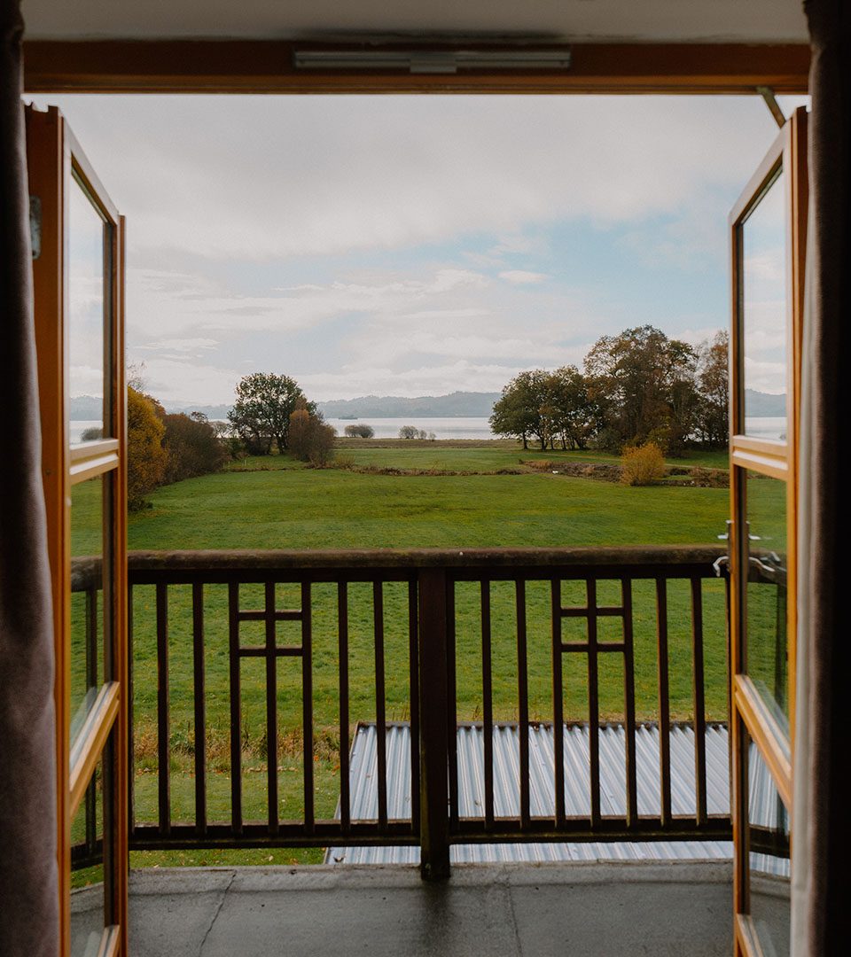 A view from a lodge balcony at Loch Lomond Waterfront luxury lodges in Balmaha