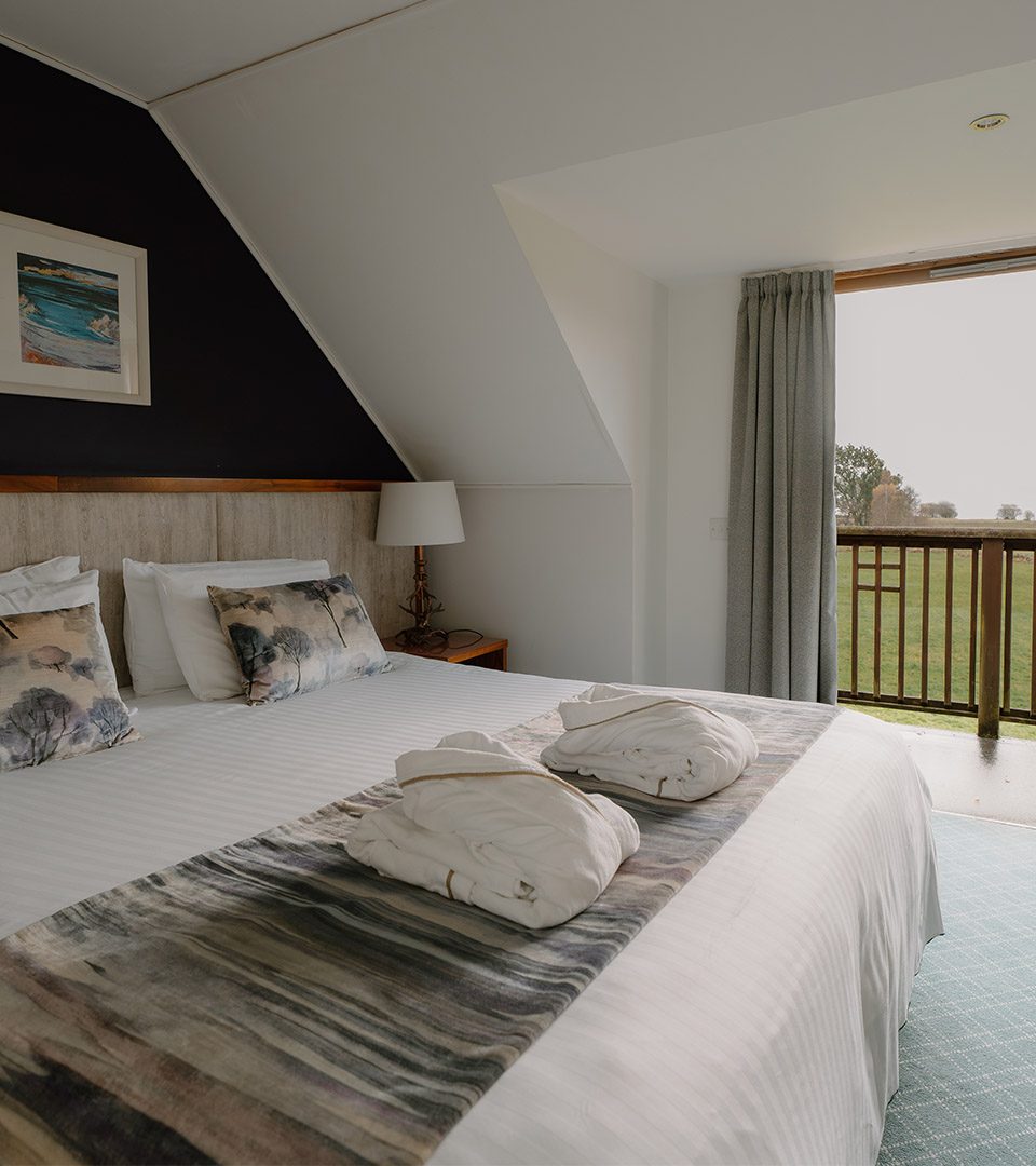 A double bedroom at Loch Lomond Waterfront luxury lodges in Balmaha