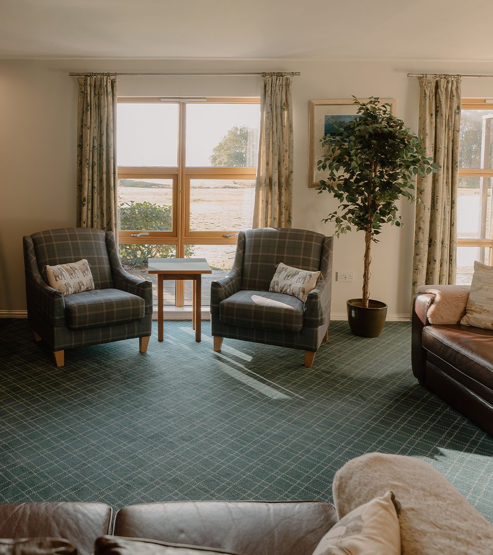 A living room in a lodge at Loch Lomond Waterfront luxury lodges in Balmaha