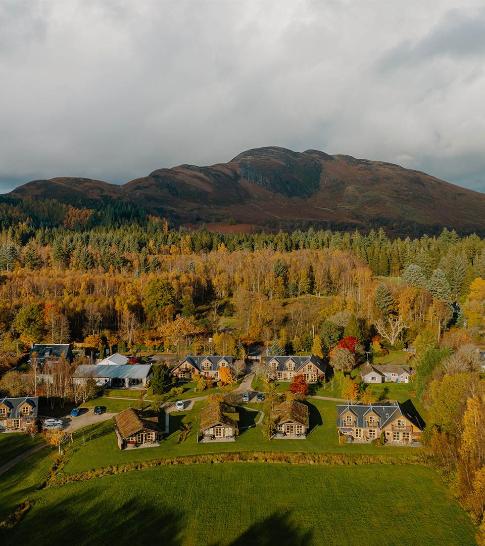 An aerial view of Loch Lomond Waterfront luxury lodges in Balmaha