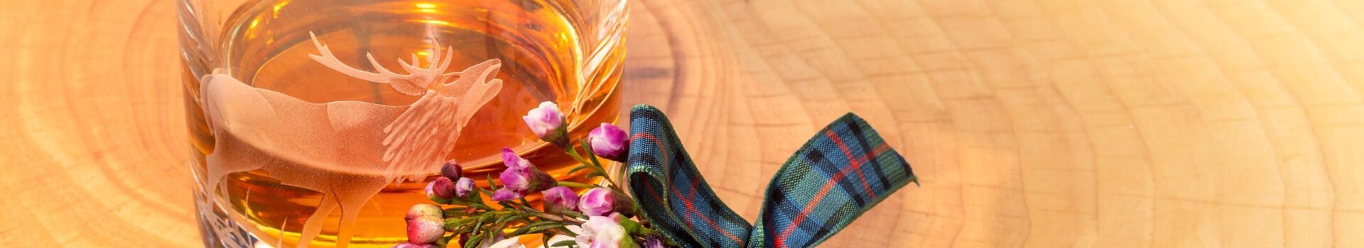 Burns Night, Scotland's tribute to the life and cultural legacy of Robert Burns, sees a ladies sprig of wild flowers alongside a glass of whisky during a formal event.